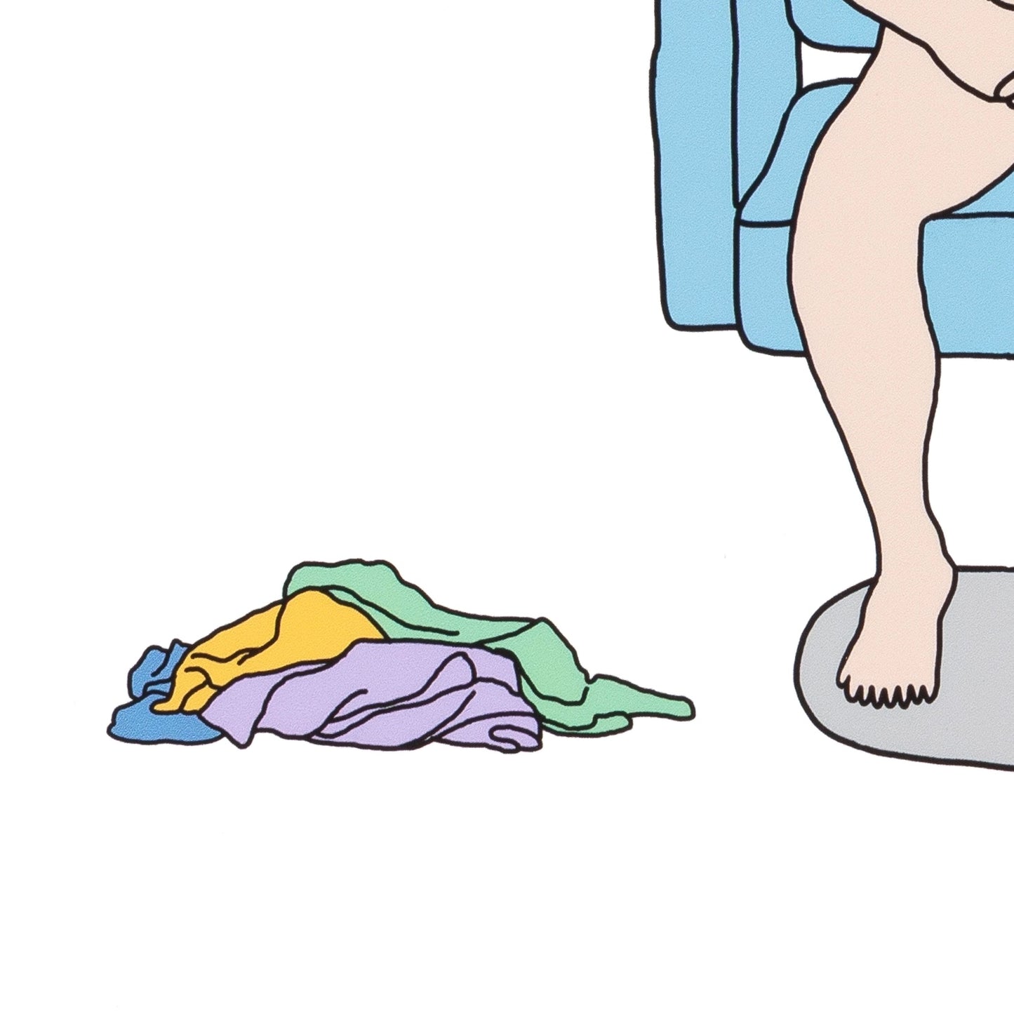 Colorful clothes on the floor next to a person sitting on a toilet.