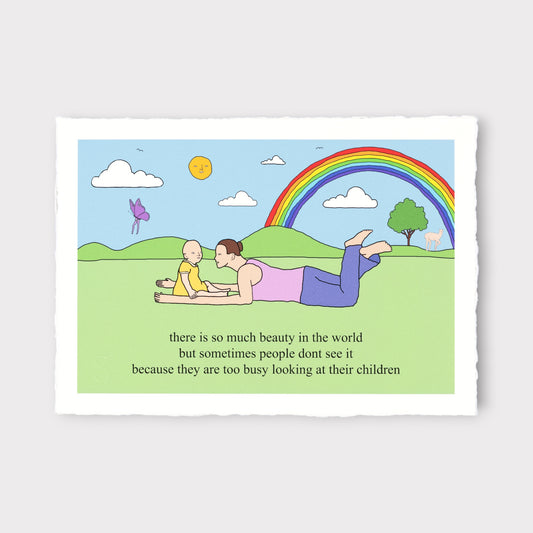 Cartoon of a man and child lying on grass with a rainbow and text about seeing beauty in children.