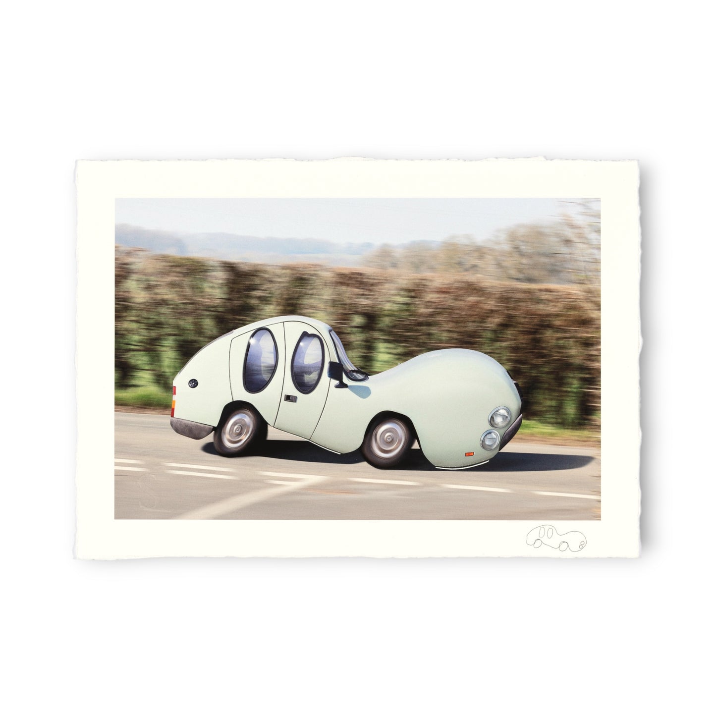 Unusual shaped car driving on a road with trees in the background