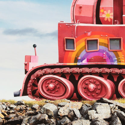 Colorful train car with a rainbow design on a rocky landscape