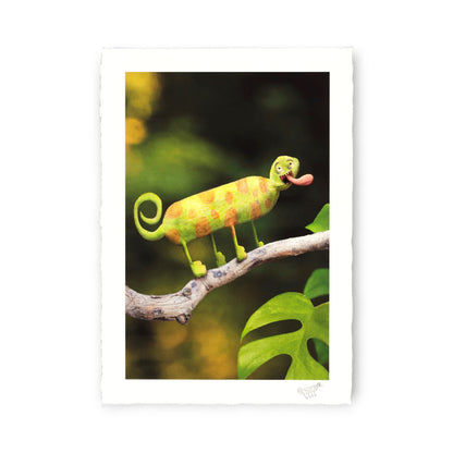 Colorful chameleon on a branch with a blurred green background